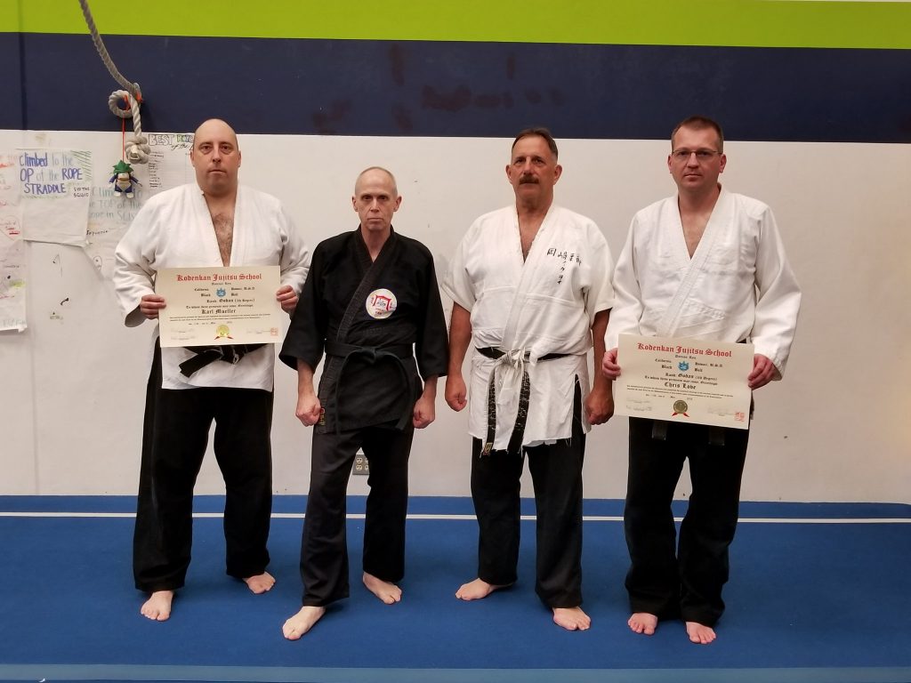 Profs. Tony Janovich and Clive Guth with Senseis Karl Mueller and Chris Love, on their promotions to 5th dan