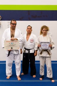 Sensei Guillermo Hernandez, Jr. with promotees Kevin and Kira